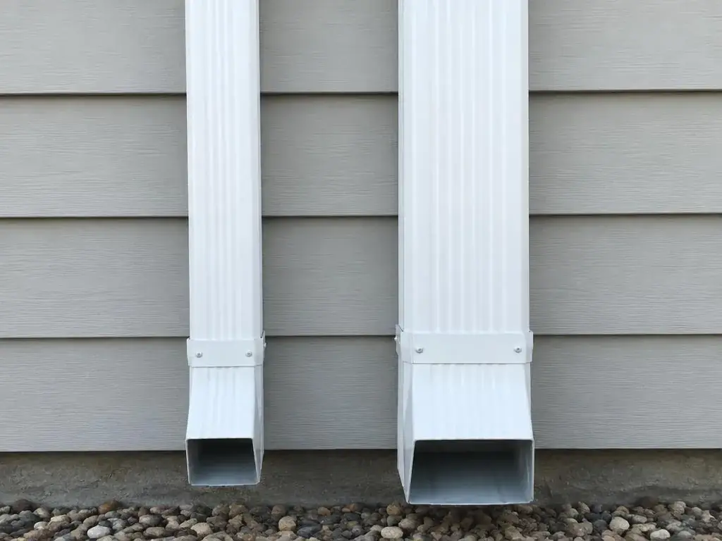 Standard 2x3-inch and larger 3x4-inch downspouts side by side