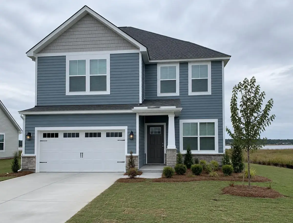 New home with a gutter installed only over the front entry