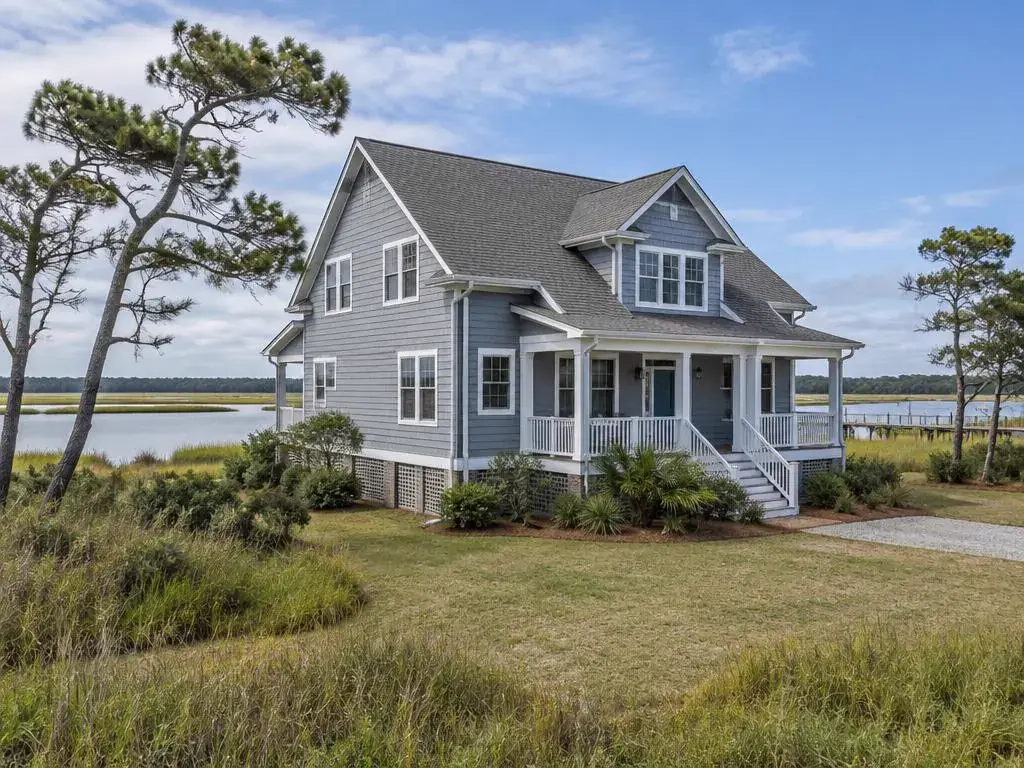 Waterfront home near a marsh with gutters and downspouts